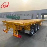 Zabojnik s ploščatimi prikolicami